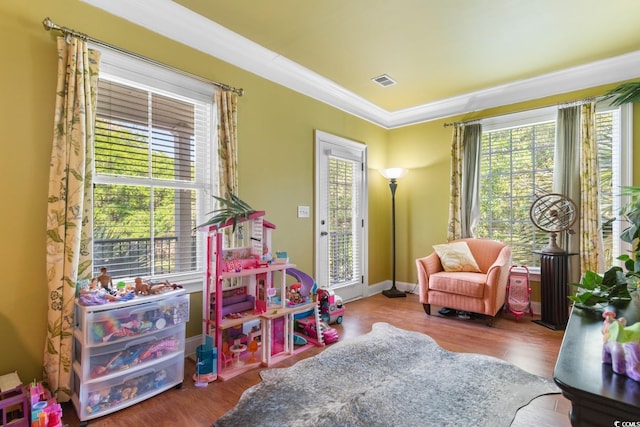 1516 James Island Ave, North Myrtle Beach, SC 29582 - game room featuring ornamental molding and wood finished floors