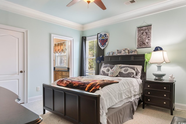 bedroom featuring crown molding, baseboards, a ceiling fan, and ensuite bathroom