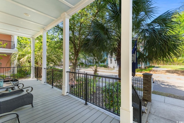 wooden terrace featuring a porch