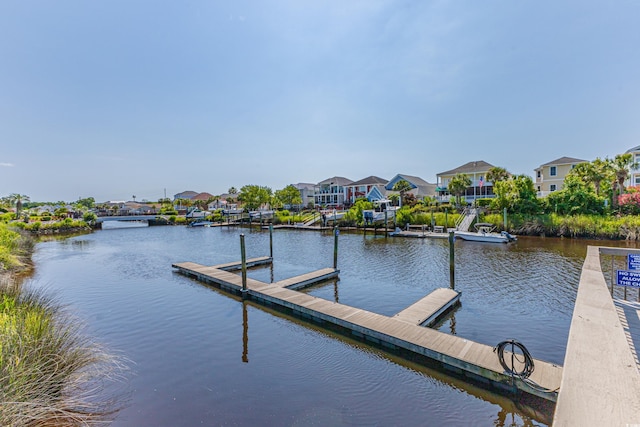dock featuring a residential view and a water view