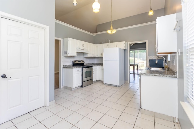 kitchen featuring stainless steel range with electric stovetop, freestanding refrigerator, under cabinet range hood, a sink, and decorative backsplash