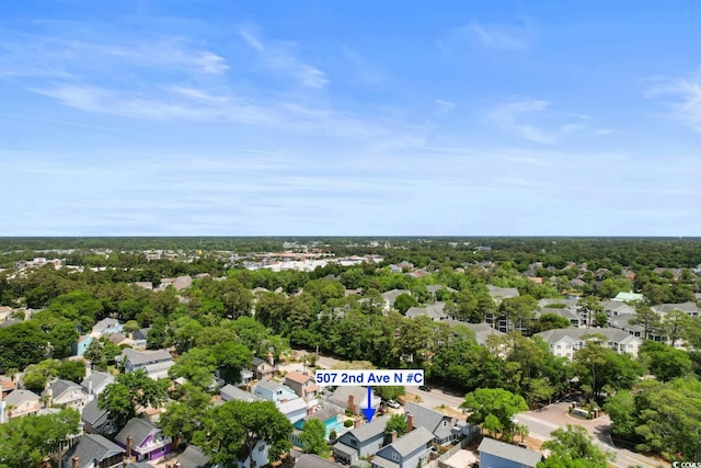 aerial view of property's location with nearby suburban area