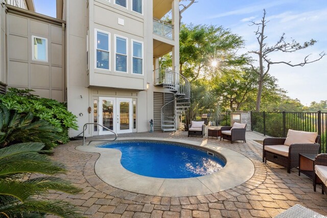 600 48th Ave S Unit 201, North Myrtle Beach, SC 29582 - view of swimming pool with french doors, stairway, a patio, fence, and outdoor lounge area