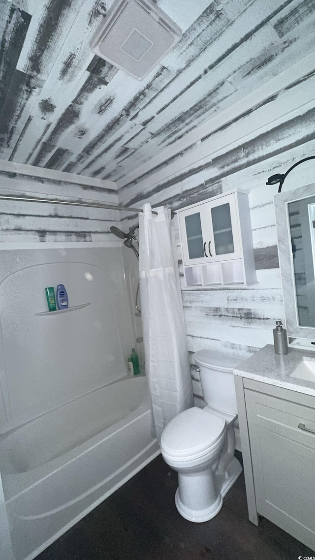 bathroom featuring shower / bath combination with curtain, toilet, vanity, wood ceiling, and wood finished floors