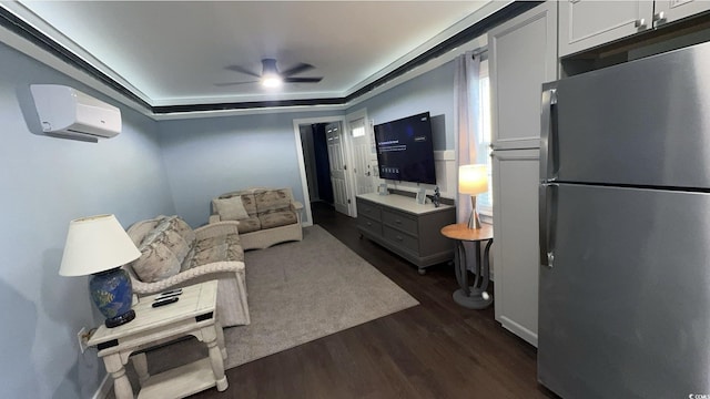living area featuring a wall mounted AC, dark wood-style floors, and ceiling fan