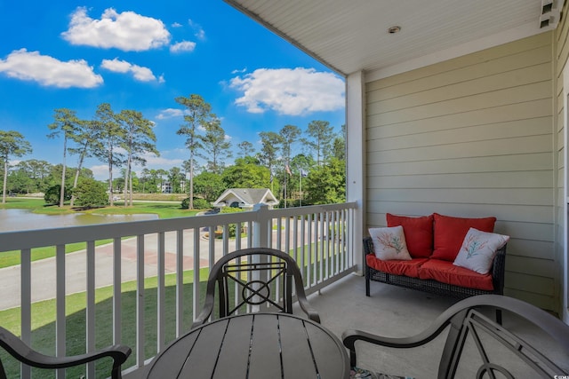 balcony with view of wooded area