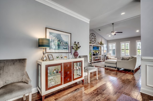living room featuring lofted ceiling, wood finished floors, ceiling fan, crown molding, and recessed lighting