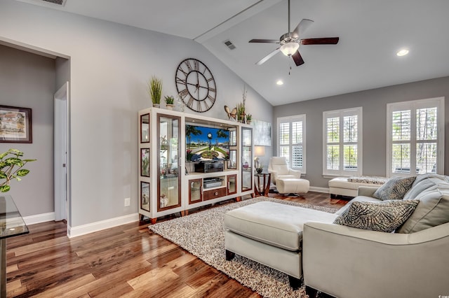 living area featuring baseboards, wood finished floors, ceiling fan, recessed lighting, and high vaulted ceiling