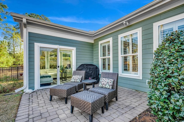 view of patio featuring fence and area for grilling