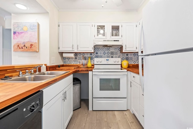 3008 Church St Unit D3, Myrtle Beach, SC 29577 - kitchen with white appliances, under cabinet range hood, a sink, crown molding, and wooden counters