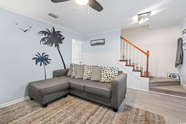 3008 Church St Unit D3, Myrtle Beach, SC 29577 - living area with stairs, ornamental molding, ceiling fan, wood finished floors, and wainscoting