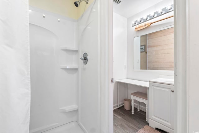 3008 Church St Unit D3, Myrtle Beach, SC 29577 - full bathroom featuring a walk in shower, vanity, and wood finished floors