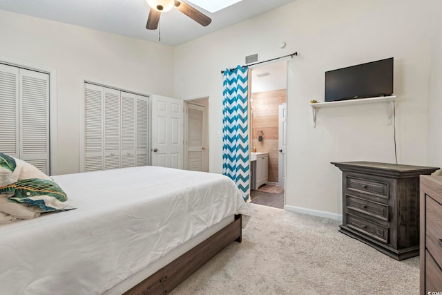 3008 Church St Unit D3, Myrtle Beach, SC 29577 - bedroom featuring multiple closets, carpet flooring, baseboards, ensuite bathroom, and a ceiling fan