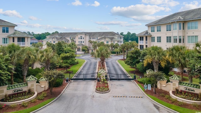 2180 Waterview Ln Unit 836, North Myrtle Beach, SC 29582 - view of asphalt street featuring a residential view, a gate, a gated entry, and curbs
