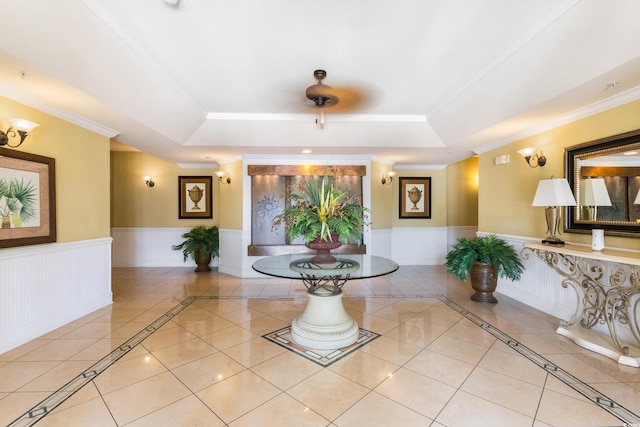 2180 Waterview Ln Unit 836, North Myrtle Beach, SC 29582 - interior space featuring wainscoting, a raised ceiling, inlaid floor details, ornamental molding, and tile patterned floors