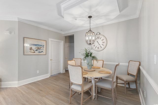 2180 Waterview Ln Unit 836, North Myrtle Beach, SC 29582 - dining space with light wood-style floors, a chandelier, crown molding, and baseboards