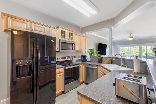 2180 Waterview Ln Unit 836, North Myrtle Beach, SC 29582 - kitchen featuring appliances with stainless steel finishes, light brown cabinetry, a sink, ornate columns, and light wood-style flooring