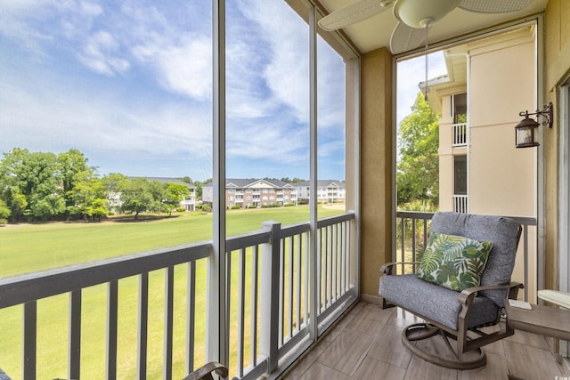 2180 Waterview Ln Unit 836, North Myrtle Beach, SC 29582 - sunroom featuring healthy amount of natural light, ceiling fan, and a residential view