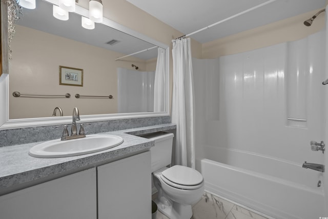bathroom with shower / bath combo, toilet, vanity, and marble finish floors