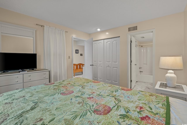 bedroom featuring marble look tiles, ensuite bath, a closet, and recessed lighting