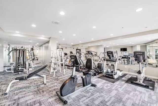 exercise room featuring carpet, recessed lighting, and baseboards