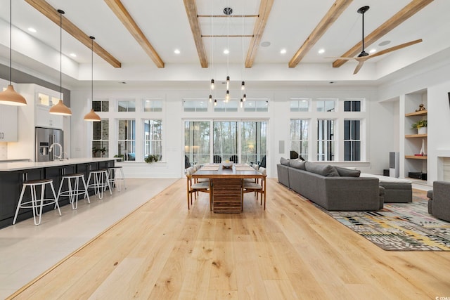341 Brickwell Ln, Pawleys Island, SC 29585 - living area with light wood finished floors, beamed ceiling, built in shelves, ceiling fan, and recessed lighting