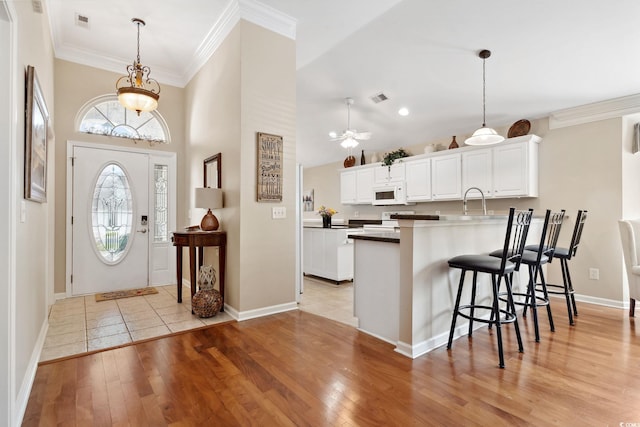 347 Kessinger Dr, Surfside Beach, SC 29575 - entryway featuring light wood finished floors, ornamental molding, baseboards, a ceiling fan, and recessed lighting