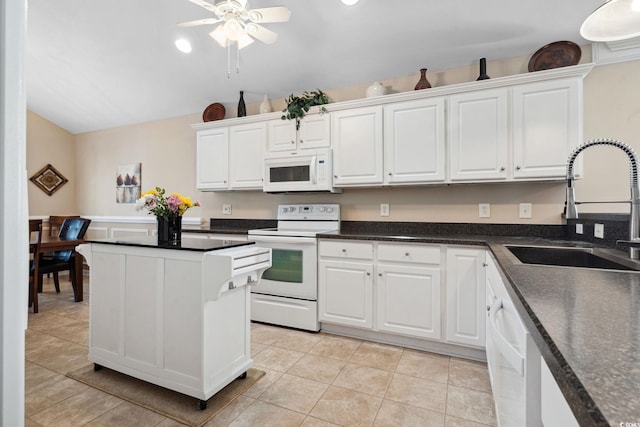 347 Kessinger Dr, Surfside Beach, SC 29575 - kitchen featuring white appliances, a sink, white cabinetry, ceiling fan, and a center island