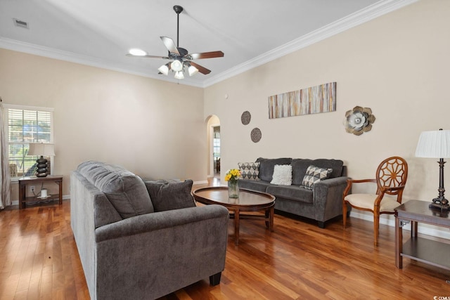 347 Kessinger Dr, Surfside Beach, SC 29575 - living area with arched walkways, ornamental molding, ceiling fan, wood finished floors, and baseboards