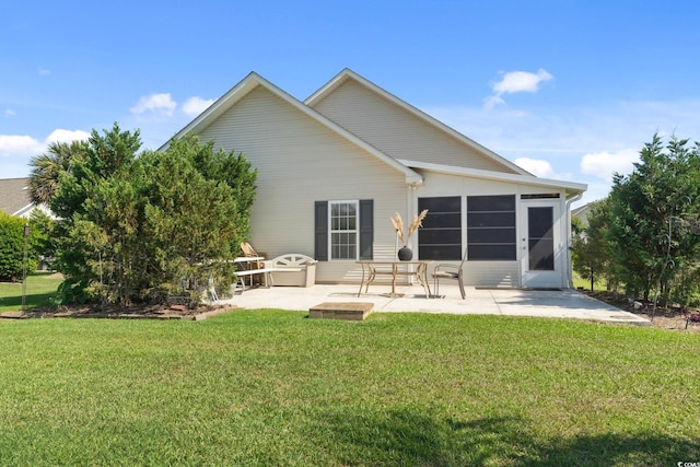 347 Kessinger Dr, Surfside Beach, SC 29575 - back of house with a patio, a lawn, and a sunroom