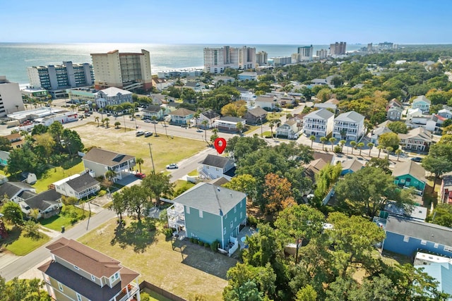 view of urban area featuring a large body of water
