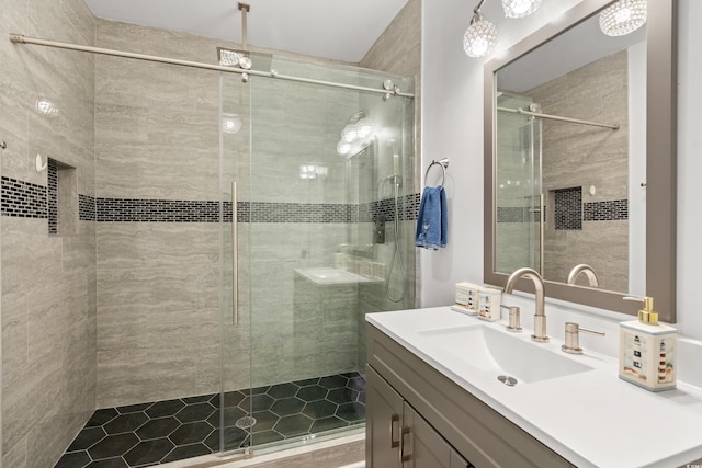 bathroom featuring a stall shower and vanity