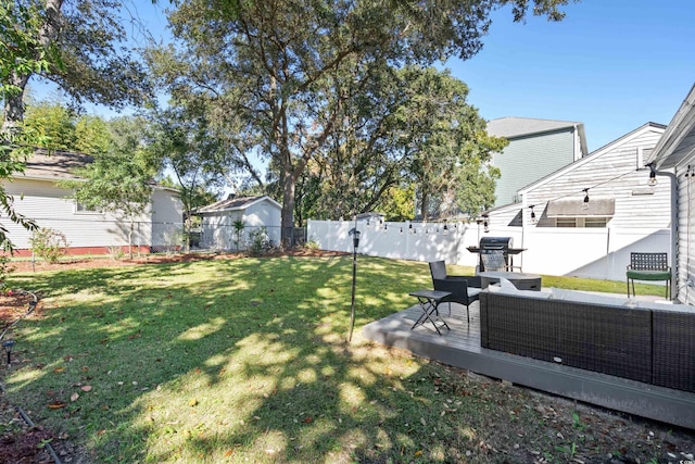 view of yard featuring an outdoor living space and a deck
