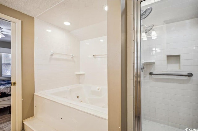 ensuite bathroom with tiled shower and a whirlpool tub