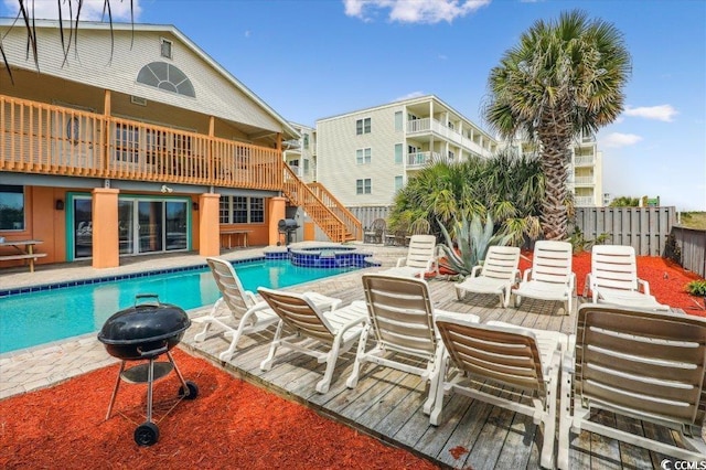 view of pool featuring a fenced backyard, stairway, an outdoor fire pit, a patio area, and outdoor dining space