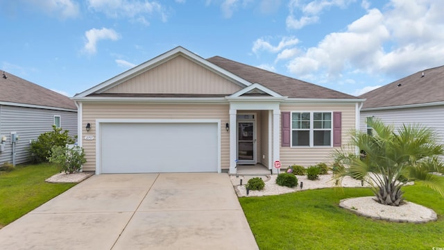 view of front of property featuring a front yard, a garage, and driveway