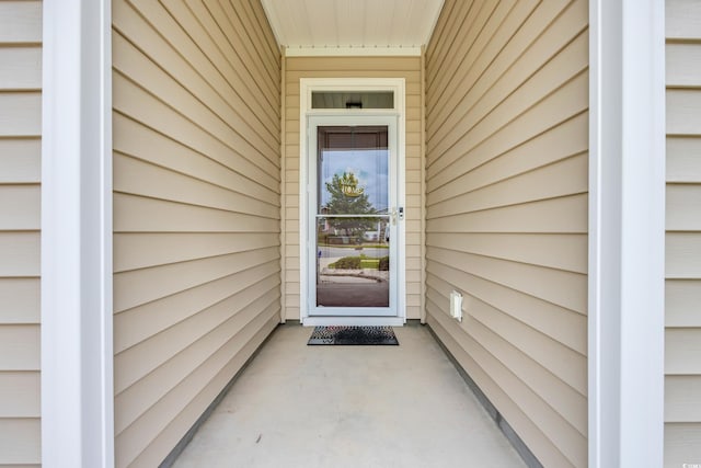 view of exterior entry featuring a garage