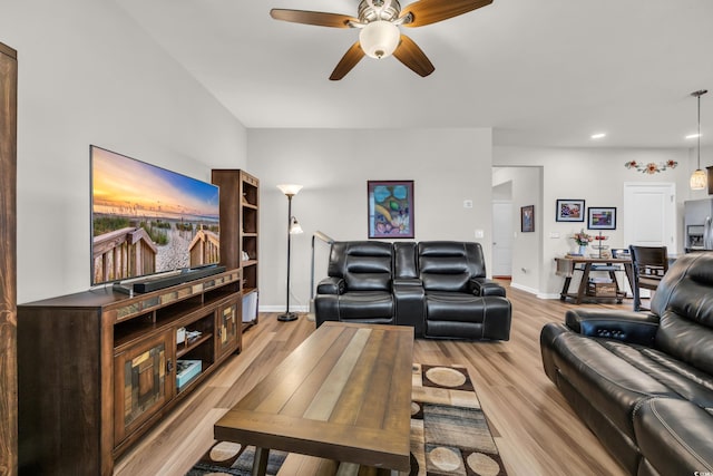 living area featuring a ceiling fan, baseboards, light wood-style flooring, and recessed lighting
