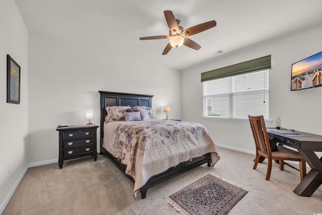 bedroom with carpet floors, baseboards, and a ceiling fan