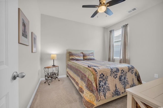 carpeted bedroom with baseboards and ceiling fan