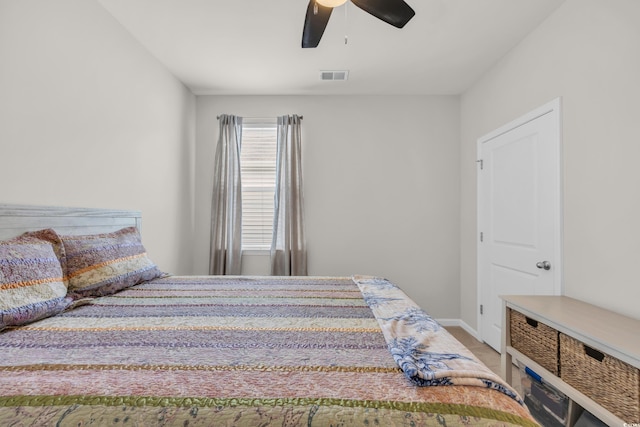 bedroom featuring baseboards and ceiling fan