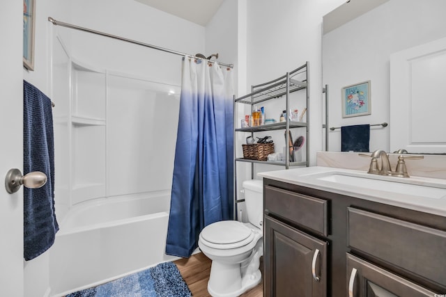 full bath with toilet, wood finished floors, vanity, and shower / bath combo with shower curtain