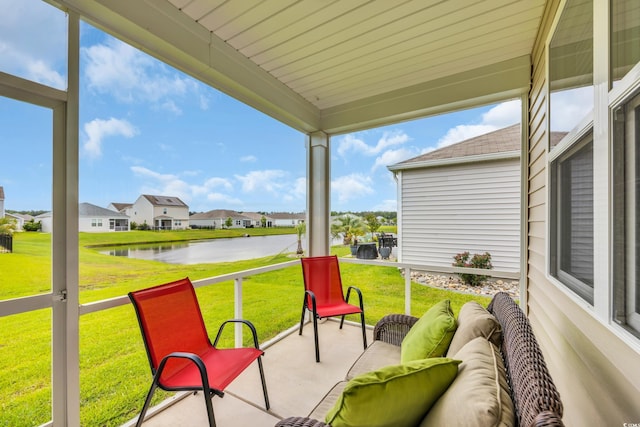 view of patio featuring a water view, a residential view, and outdoor lounge area