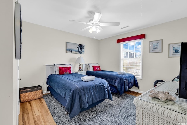 969 S Waccamaw Dr, Garden City Beach, SC 29576 - bedroom featuring light wood-type flooring, baseboards, and ceiling fan