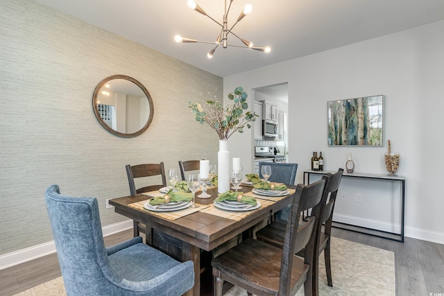 814 Belle Dr, North Myrtle Beach, SC 29582 - dining room featuring baseboards, a chandelier, and wood finished floors