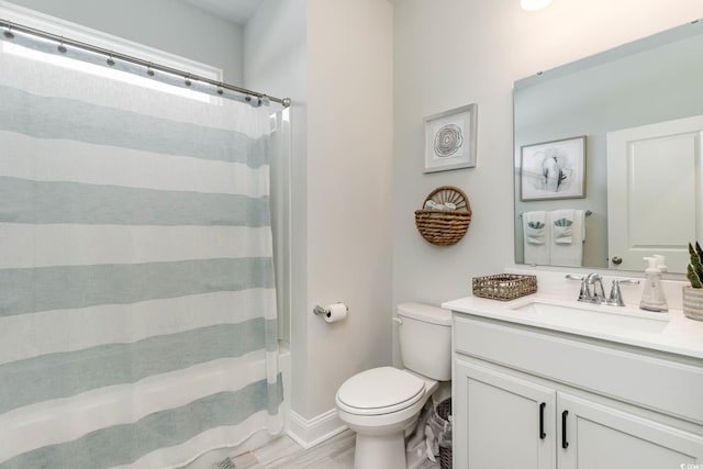 814 Belle Dr, North Myrtle Beach, SC 29582 - full bathroom featuring toilet, vanity, wood finished floors, and baseboards