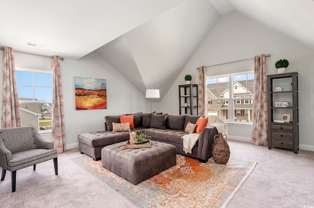814 Belle Dr, North Myrtle Beach, SC 29582 - living area featuring light colored carpet, lofted ceiling, healthy amount of natural light, and baseboards