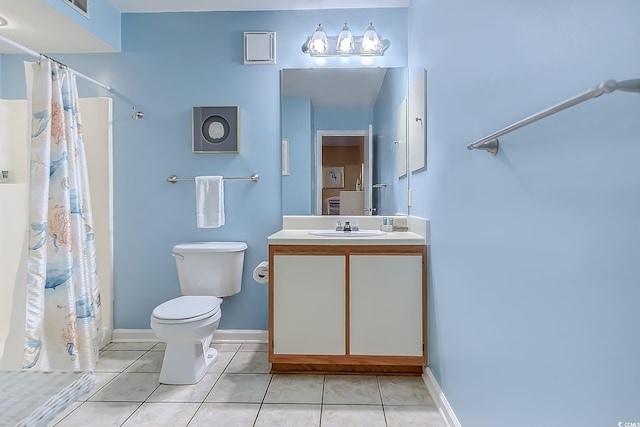 bathroom featuring toilet, tile patterned flooring, vanity, a shower with curtain, and baseboards