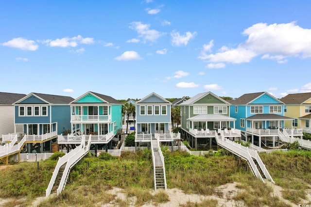17 N Seaside Dr, Surfside Beach, SC 29575 - rear view of property with stairway and a residential view