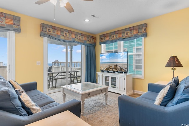 17 N Seaside Dr, Surfside Beach, SC 29575 - living room featuring a ceiling fan, recessed lighting, baseboards, and wood finished floors